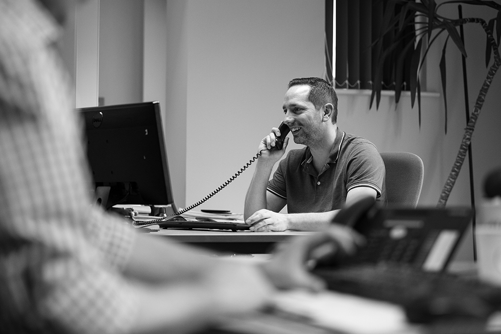 Image of a man on the phone in Avocet office